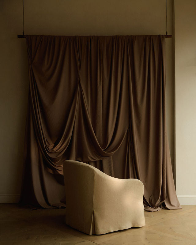 Ocra upholstered linen chair by Frances Jean in Chelsea furniture showroom 