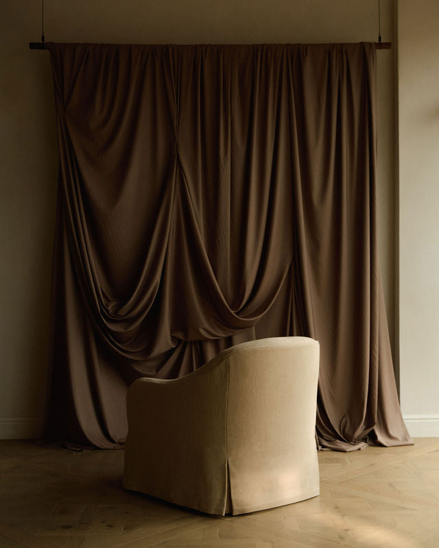 Ocra upholstered linen chair by Frances Jean in Chelsea furniture showroom 